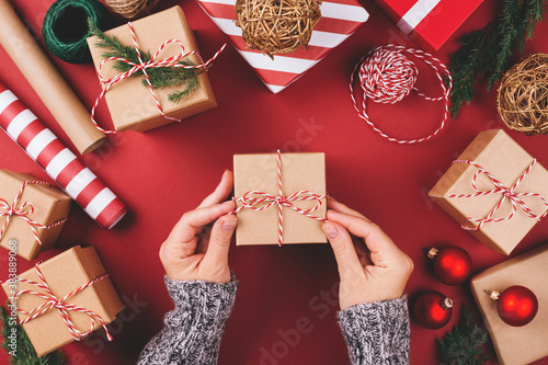 Christmas background with gift boxes and decorations on red. Preparation for ...