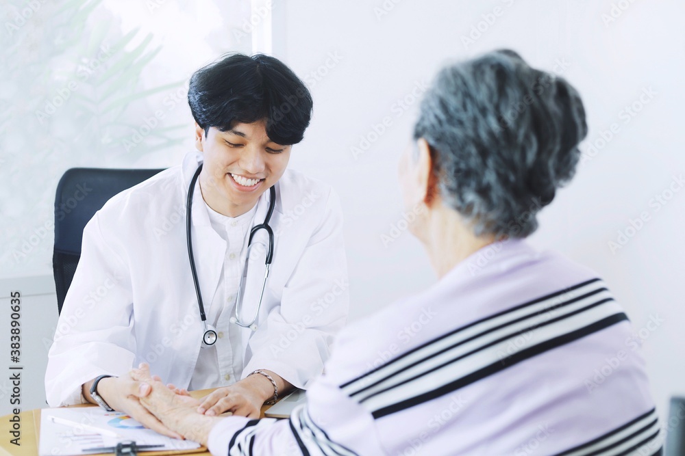Young doctor examining elderly woman in hospital. Young doctor examining elderly woman in hospital.