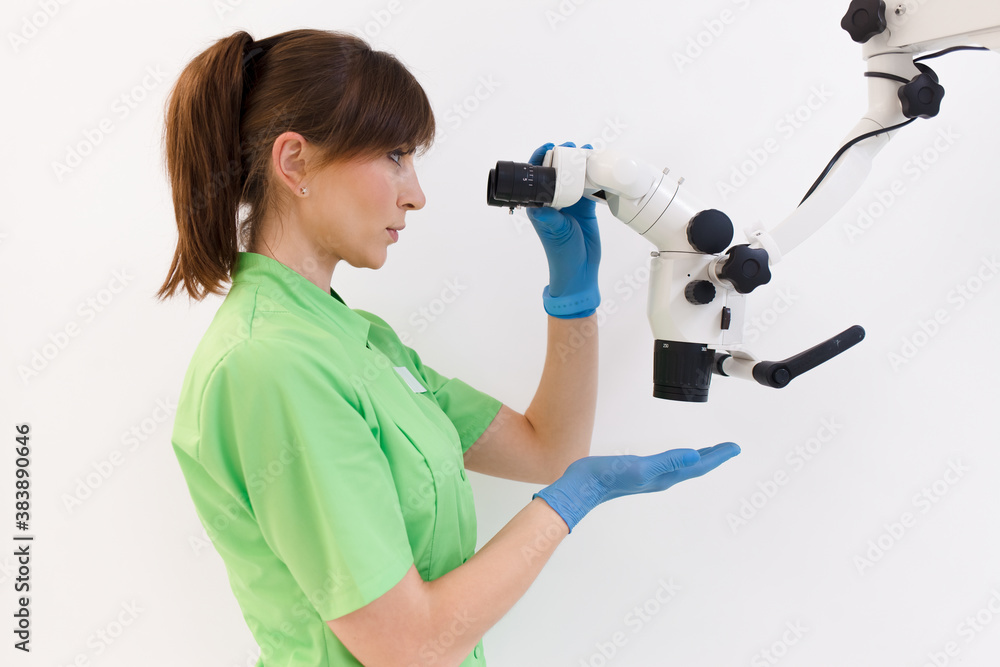 Dentist doctor using dental microscope Dentist doctor using dental microscope