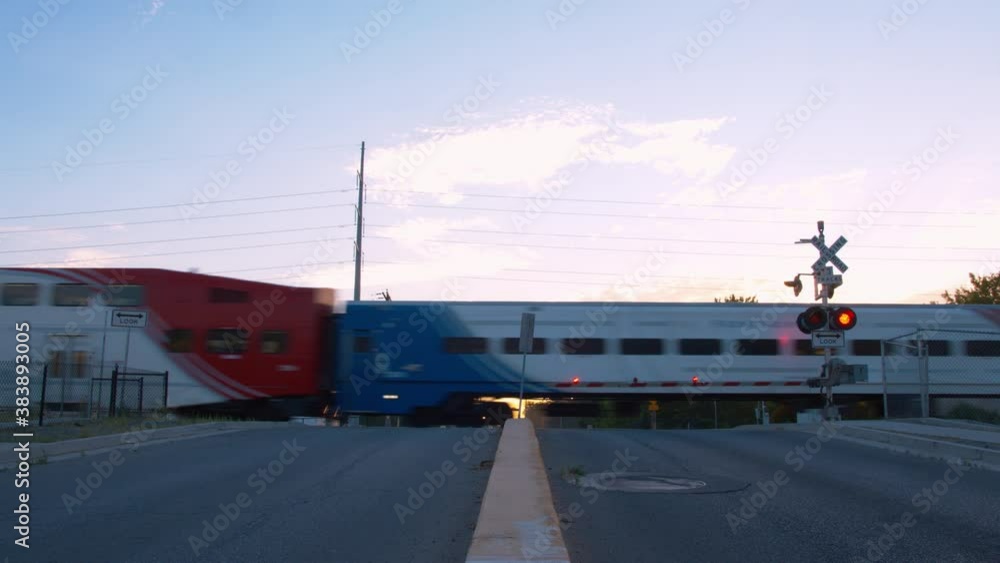 A train passes at a train stop when the gate lights are flashing and that gates are down. Train passes A train passes at a train stop when the gate lights are flashing and that gates are down. Train passes