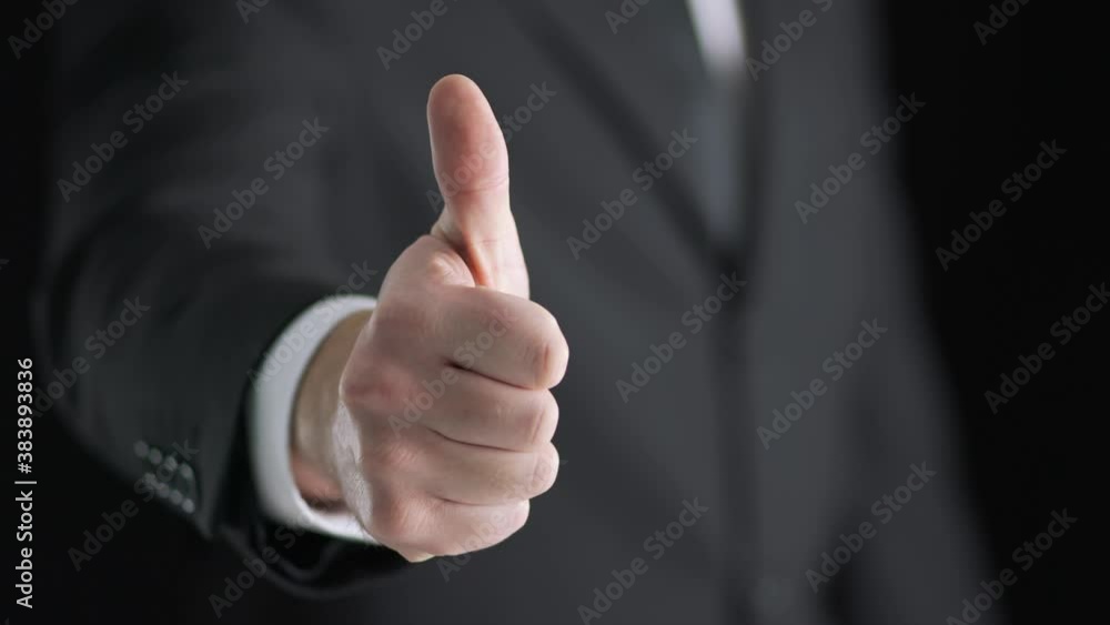 Business man in suit giving thumbs up. Lawyer showing positive hand gesture. Happy real estate agent. Business man in suit giving thumbs up. Lawyer showing positive hand gesture. Happy real estate agent.