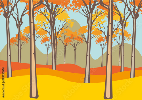 Bosque otoñal con montañas al fondo.