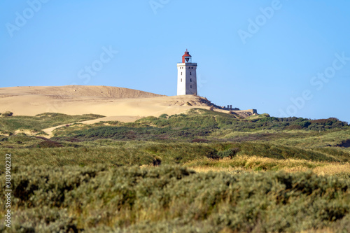 The landscape and lighthouse of Rubjerg Knude in Denmark on the north sea coast