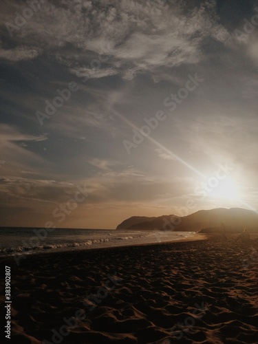 Sunset in the beach with a blue sky