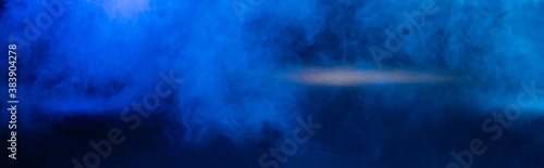 panoramic crop of dark blue background with smoke and copy space