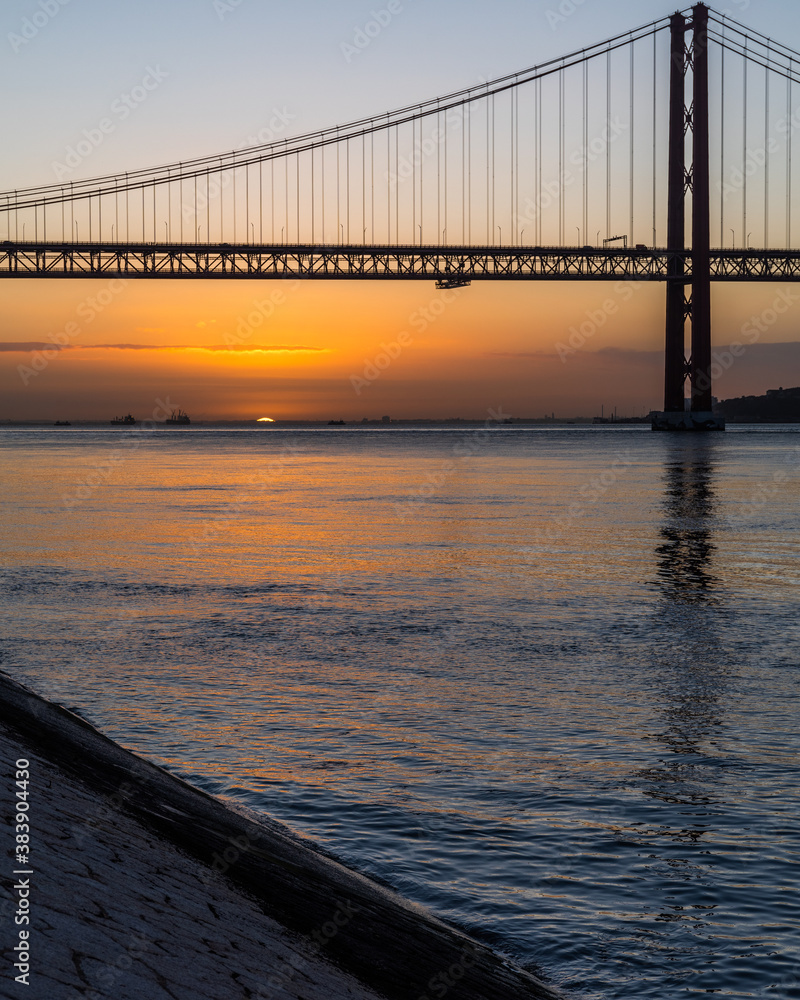 Sunrise by the 25 de Abril Bridge in Lisbon