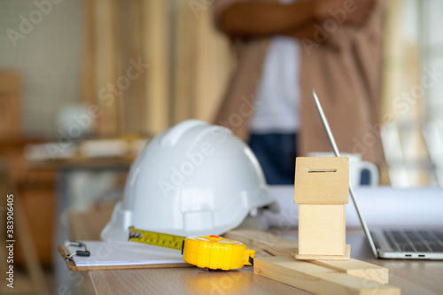 senior Asian man working on wood  work home improvement DIY in workshop recoding streaming online