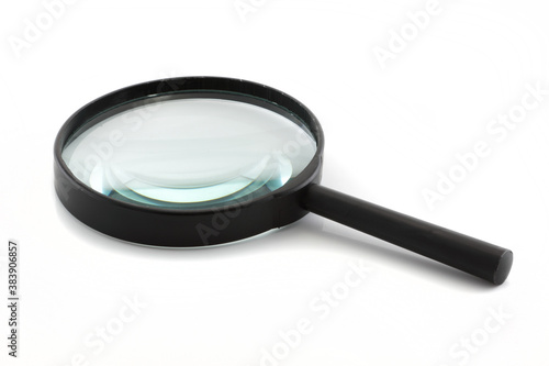 Magnifying glass isolated on white with blue lens refraction