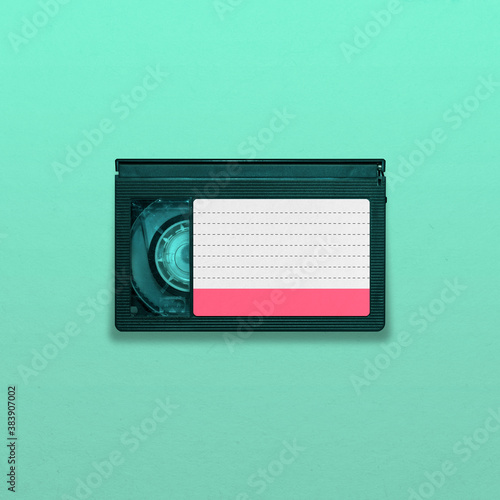 VHS-C video tape cassette isolated  on blue background, pop art design, close up