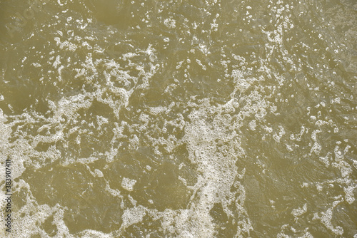 foam and bubbles on the water surface