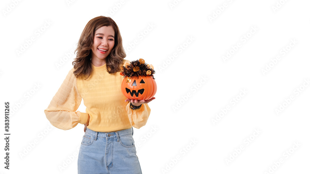 Portrait of Asian smiling woman holding curved pumpkin and looking at pumpkin isolated over white background Halloween concept. Portrait of Asian smiling woman holding curved pumpkin and looking at pumpkin isolated over white background Halloween concept.