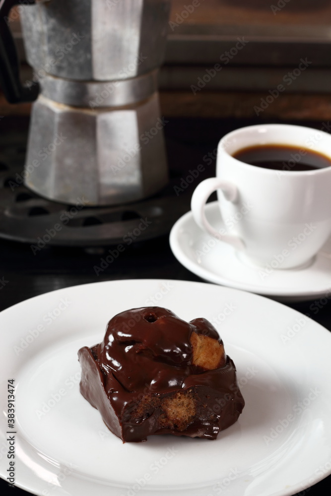 Choux with chocolate ganache and coffee cup