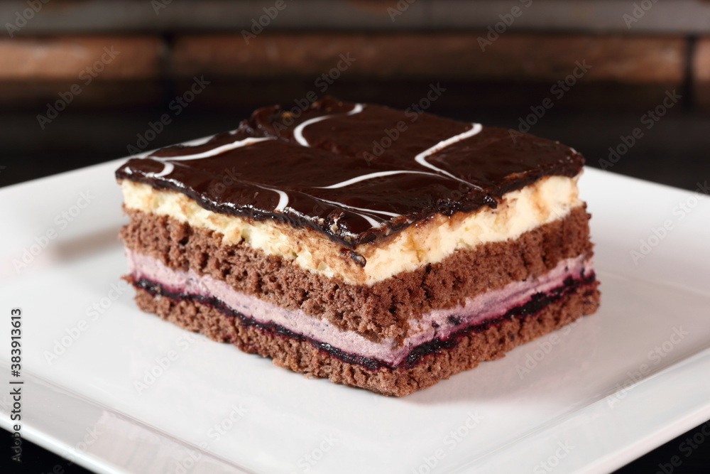 Layer cake with fruit and cream fillings decorated chocolate icing Layer cake with fruit and cream fillings decorated chocolate icing