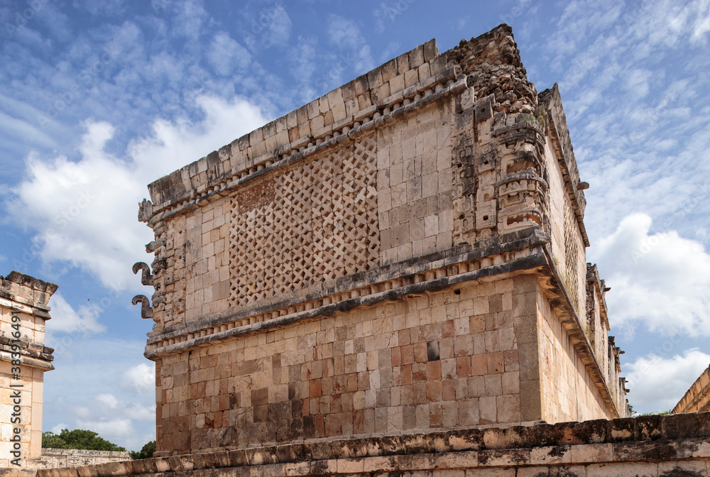 A beautifully decorated building from the Quadrangle of the Nuns in the archaeological site of Uxmal, Yucatan Peninsula, Mexico