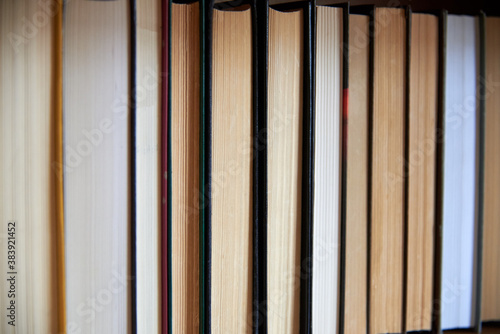Book spines lined up, close-up, learning and education concept.