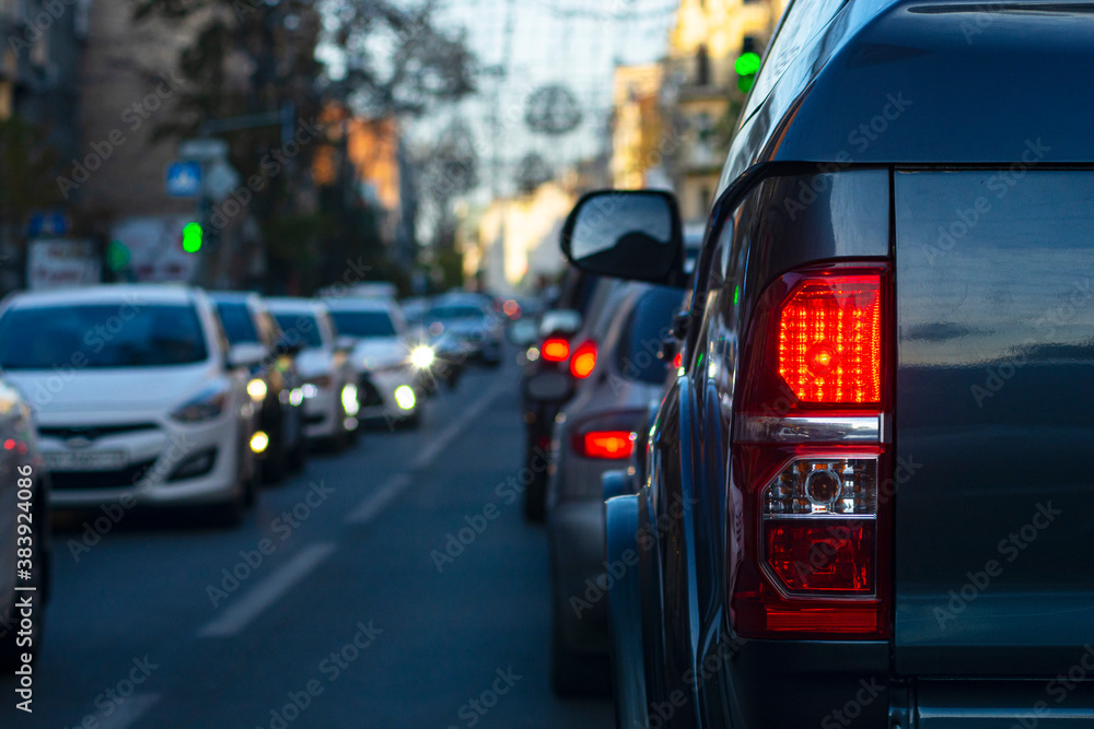 Peak hour. City traffic jam in downtown. People are driving home from work. Peak hour. City traffic jam in downtown. People are driving home from work.