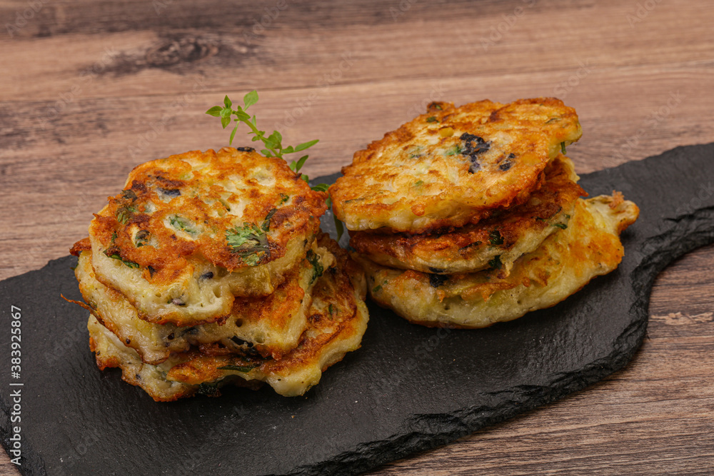 Zucchini pancakes with herbs and spices