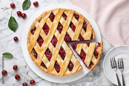Принти на полотні Delicious fresh cherry pie served on white marble table, flat lay