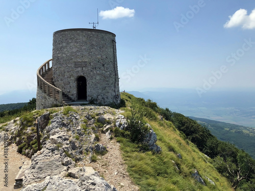 The Vojak observation Tower or Stone viewing tower at Vojak peak or Kula na Vojaku - Nature Park Ucka, Croatia / Razgledna kamena kula na Vojaku ili Vidikovac kula Vojak - Park prirode Učka, Hrvatska photo