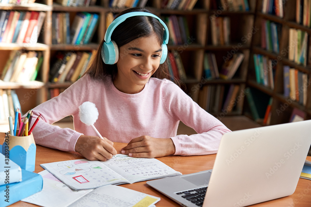 Happy Indian Latin Preteen Girl School Pupil Wearing Headphones