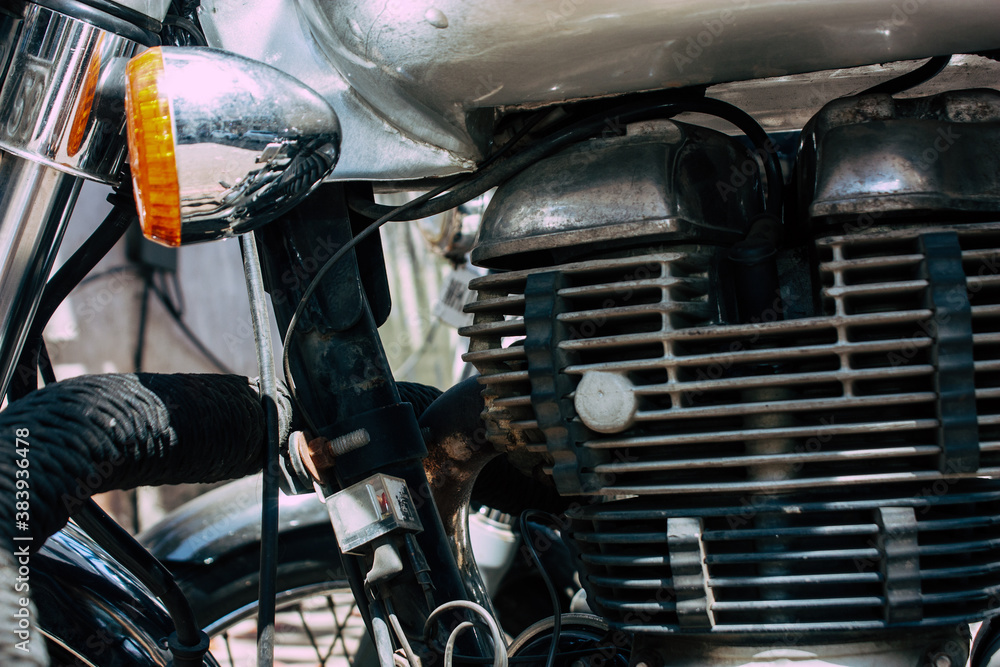 Closeup of a motorcycle parked in the streets of the city center of the metropolitan area
Closeup of a motorcycle parked in the streets of the city center of the metropolitan area