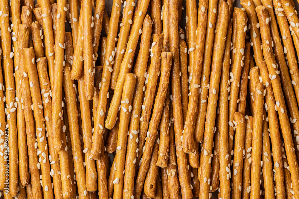 Salty sticks. Crunchy pretzels with sesame seeds. Salty sticks. Crunchy pretzels with sesame seeds.