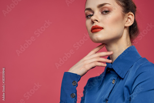 Portrait of emotional woman in blue shirt with bright makeup gesturing with hands Copy Space