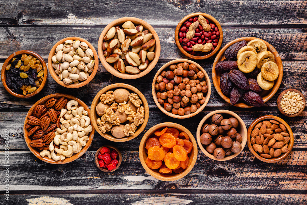 Various Nuts and dried fruits in wooden bowls. Various Nuts and dried fruits in wooden bowls.