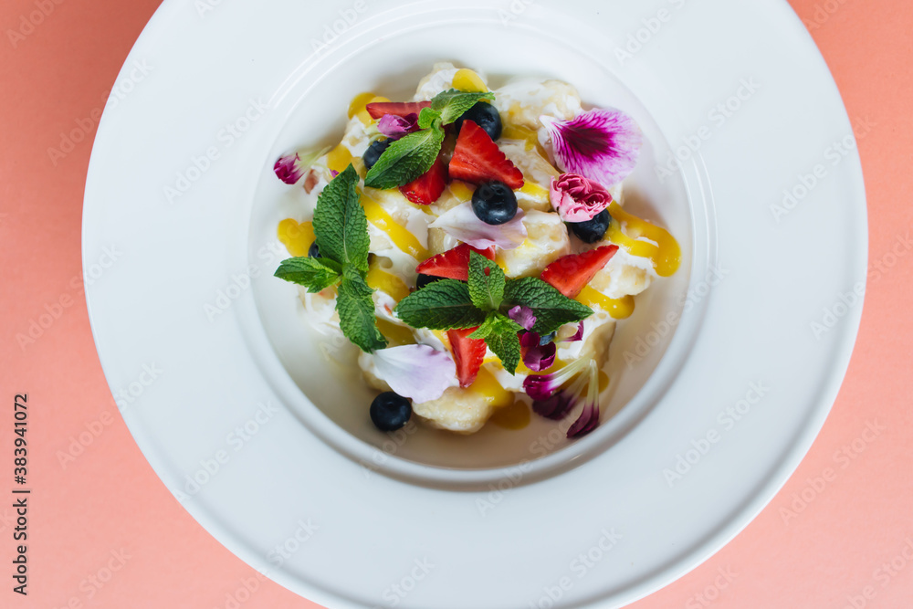 bowl of healthy salad with fresh berries and cheese bowl of healthy salad with fresh berries and cheese