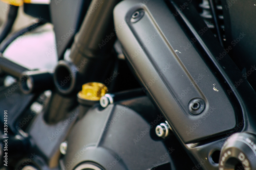 Closeup of a motorcycle parked in the streets of the city center of the metropolitan area
