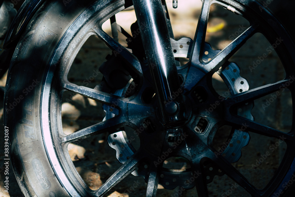 Fototapeta premium Closeup of a motorcycle parked in the streets of the city center of the metropolitan area 