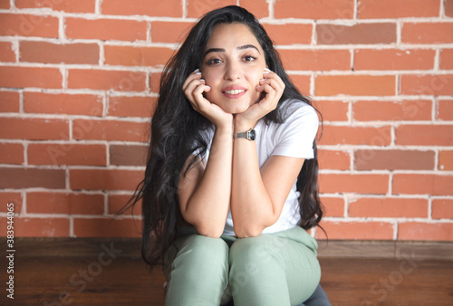 happy woman in brick wall background