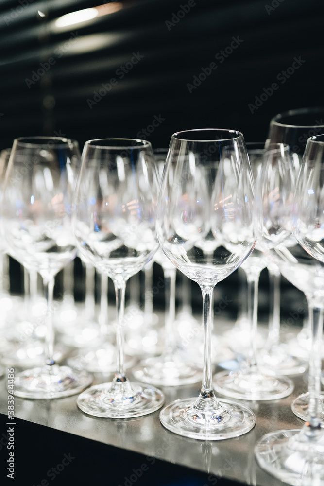 many clean wineglasses in bar, professional equipment , relax time, shiny wineglasses for catering food, kitchenware supply shop products many clean wineglasses in bar, professional equipment , relax time, shiny wineglasses for catering food, kitchenware supply shop products