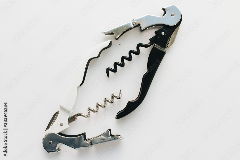 Metal corkscrew on white background, open wine bottle equipment, drinks concept, wine cork opener Metal corkscrew on white background, open wine bottle equipment, drinks concept, wine cork opener