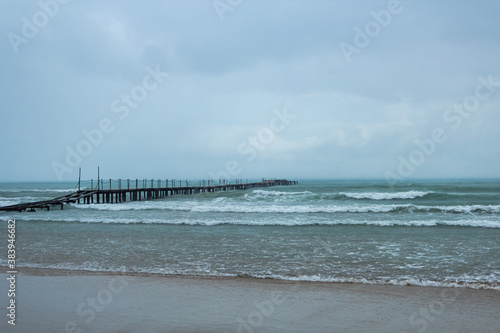 sea wooden pier on a rainy day