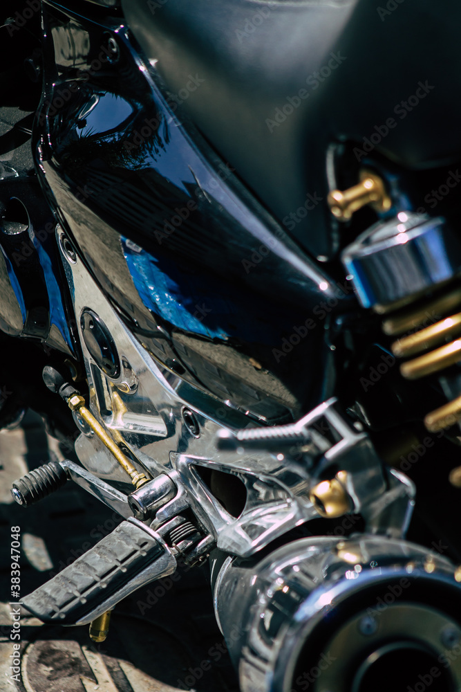 Closeup of a motorcycle parked in the streets of the city center of the metropolitan area
