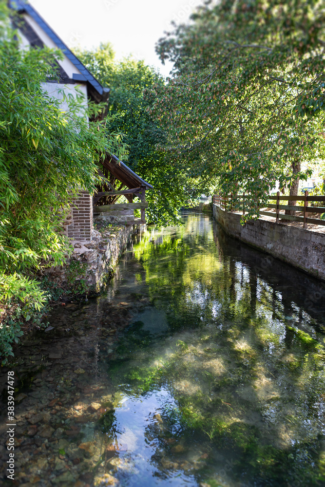 Building reflection in river, Bernay Normandy,France, eptember 2020 Building reflection in river, Bernay Normandy,France, eptember 2020