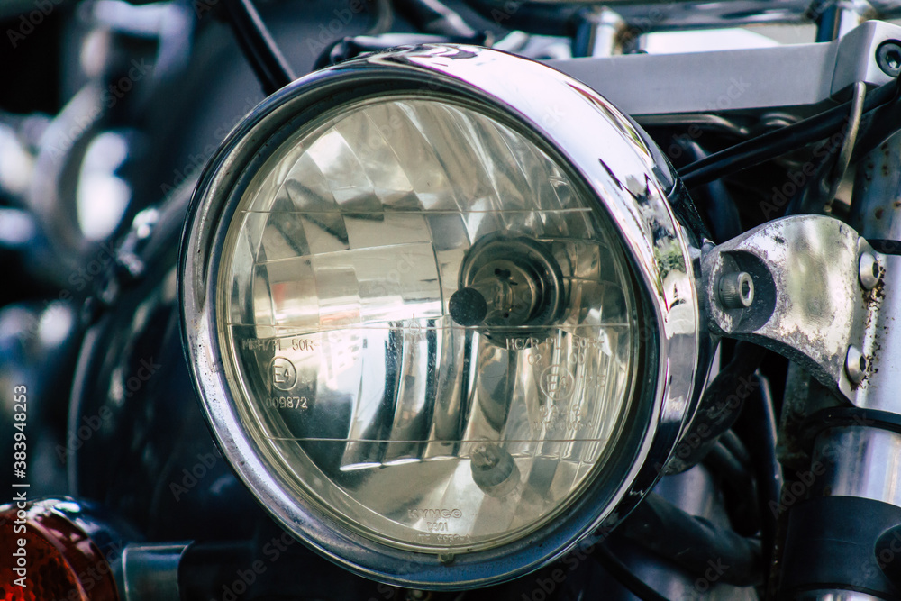 Closeup of a motorcycle parked in the streets of the city center of the metropolitan area
Closeup of a motorcycle parked in the streets of the city center of the metropolitan area