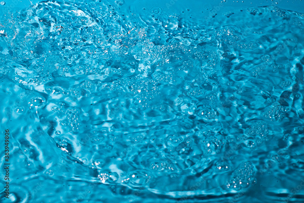 splash of water on a blue background. Abstract wallpaper splash of water on a blue background. Abstract wallpaper
