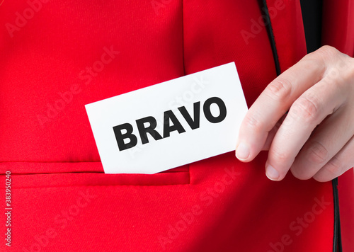 Message on the card BRAVO, in hands of businessman.