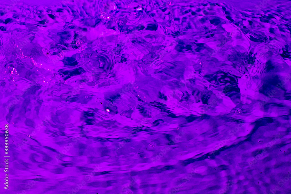 splash of water in lilac light. Abstract wallpaper