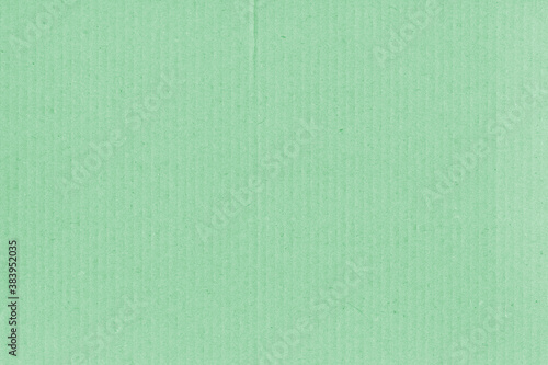 A vintage rough sheet of the carton with a gradient color. Recycled environmentally friendly retro cardboard paper texture. Simple and bright minimalist papercraft background.