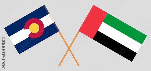 Crossed flags of The State of Colorado and the United Arab Emirates