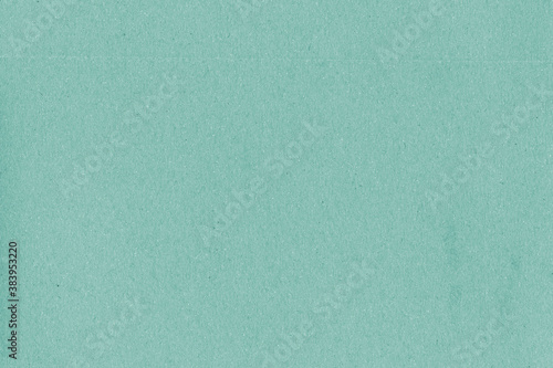 A vintage rough sheet of the carton with a gradient color. Recycled environmentally friendly retro cardboard paper texture. Simple and bright minimalist papercraft background.