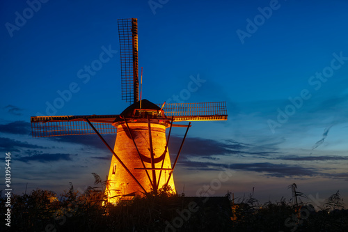 Illuminated windmill at Kinderdijk, The Netherlands.