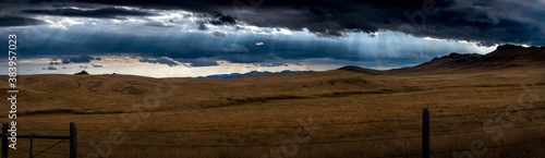 The sky shining over the valley near Wolf Creek Montana.