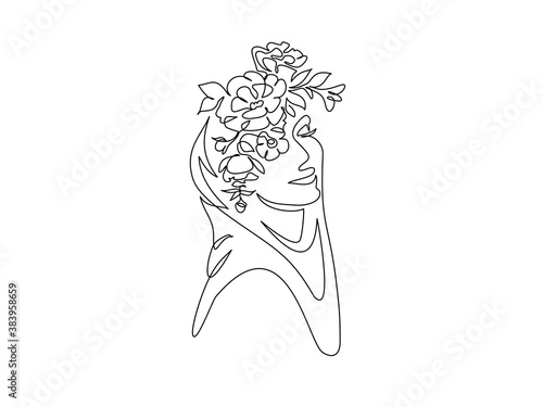 Young happy woman in hijab with flowers on her face