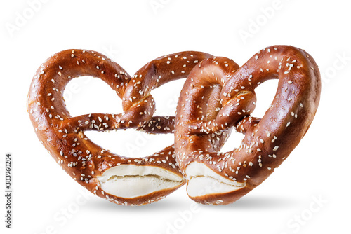 Pretzel with salt and sesame seeds on a white isolated background