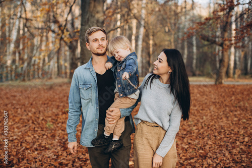 happy family mother father and baby on autumn walk in the park © dsheremeta