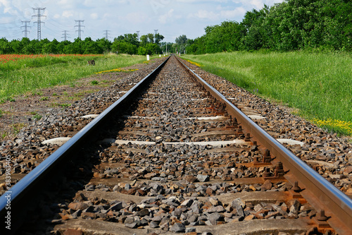 Railway tracks in straight line in the countryside in Eastern Hungary
